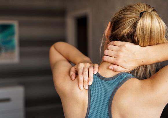 Lady holding neck and stretching